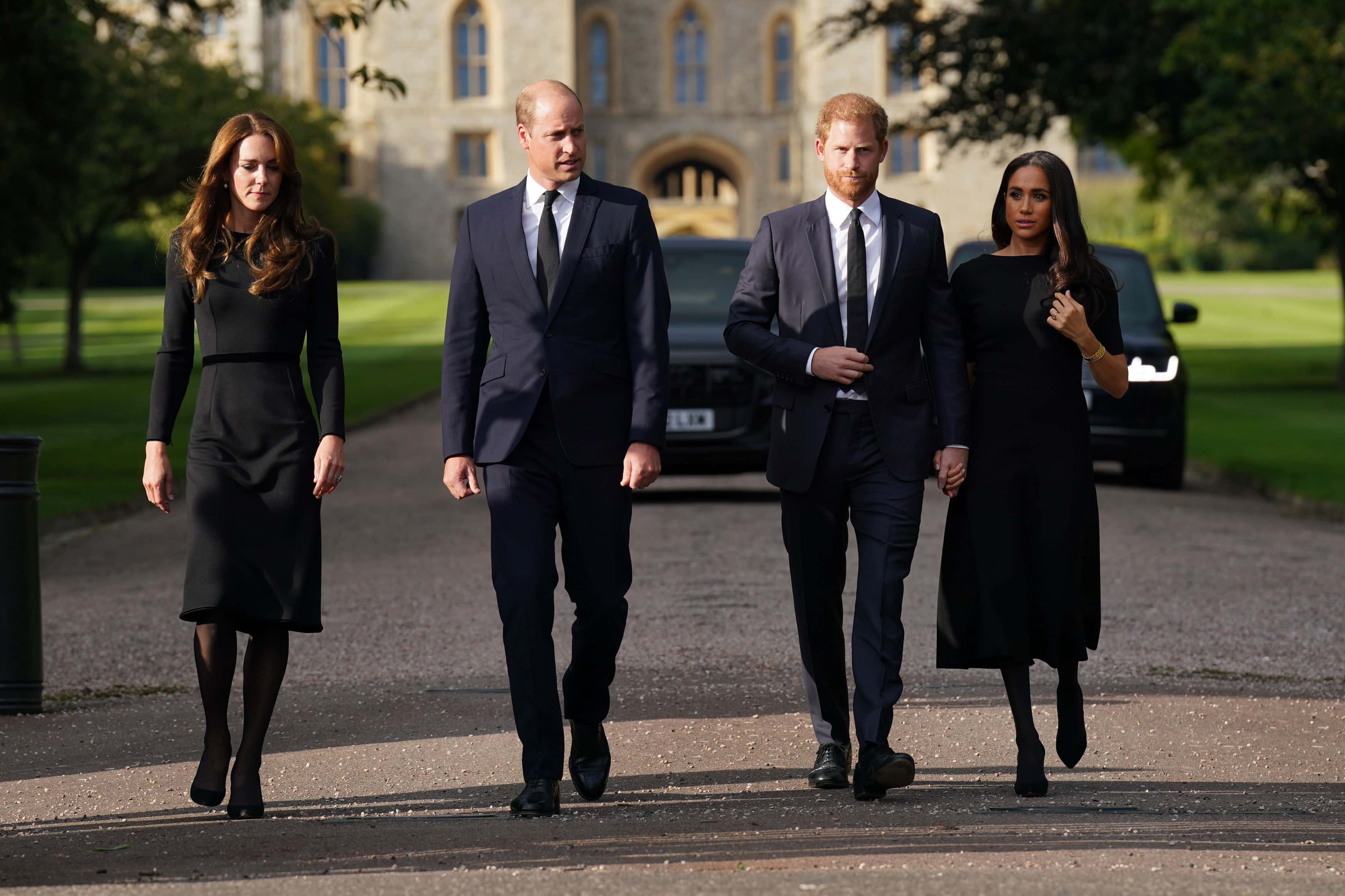Catherine, Princess of Wales, Prince William, Prince of Wales, Prince Harry, Duke of Sussex, and Meghan, Duchess of Sussex on the long Walk at Windsor Castle on September 10, 2022 in Windsor, England. Crowds have gathered and tributes left at the gates of Windsor Castle to Queen Elizabeth II, who died at Balmoral Castle on 8 September, 2022.