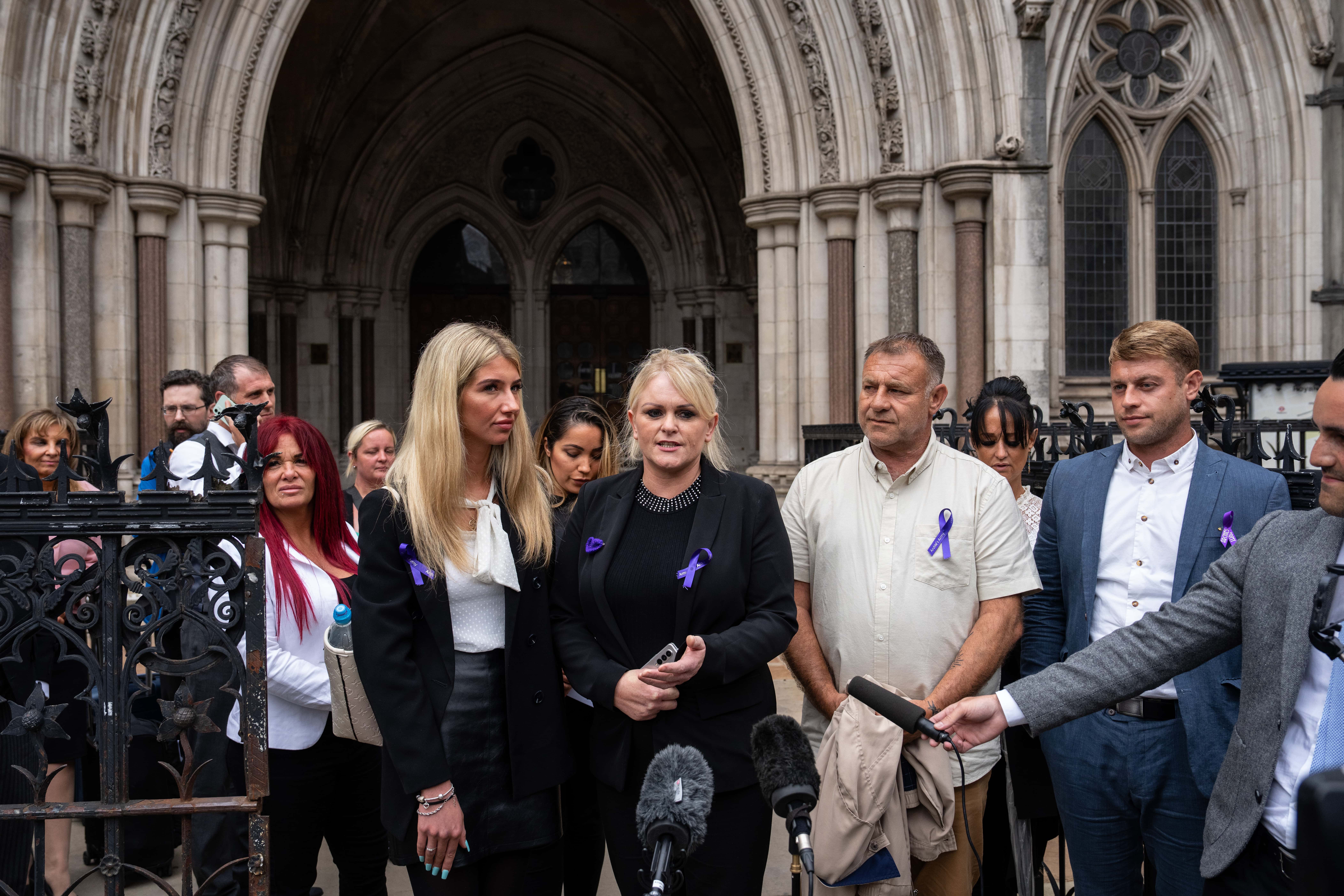 Hollie Dance (C-L) and Paul Battersbee (C-R), the mother and father of Archie Battersbee, speak to the media as they leave the Royal Courts of Justice after winning an appeal for his case to be heard again, on June 29, 2022 in London, England. The Court of Appeal has heard a plea by the family of 12-year-old Archie Battersbee to overturn a previous court ruling that he is dead and his life support system should be removed. His parents Hollie Dance and Paul Battersbee have appealed the ruling, saying his heart is still beating and they want treatment to continue.
