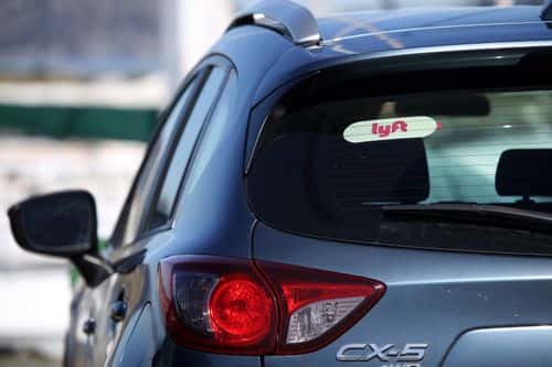 The Lyft logo is displayed on a car on March 11, 2019 in San Francisco, California. On-demand transportation company Lyft has filed paperwork for its initial public offering that is expected to value the company at up to $25 billion.