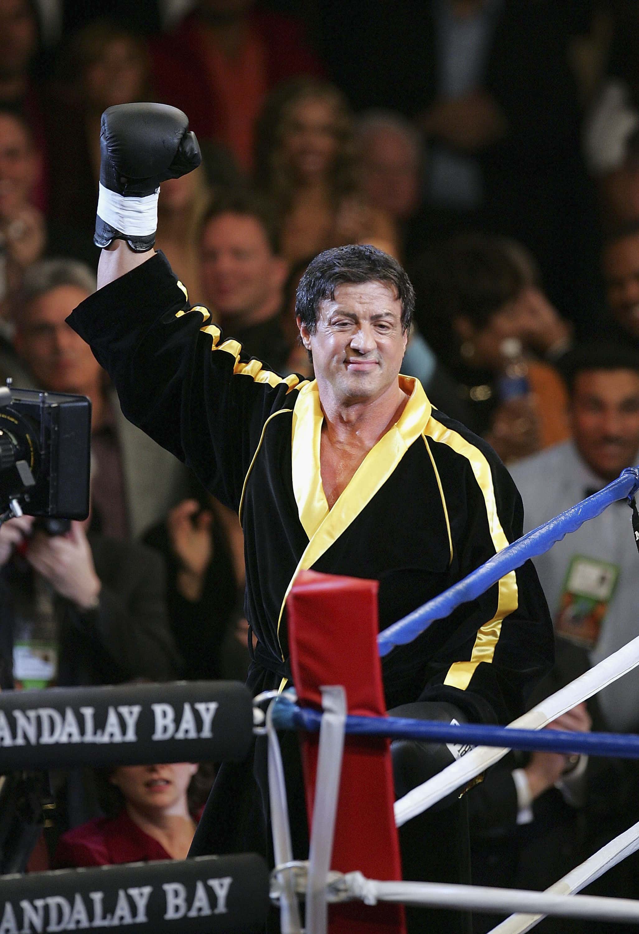 LAS VEGAS - DECEMBER 03: Actor Sylvester Stallone waves to the crowd as scenes from the film 