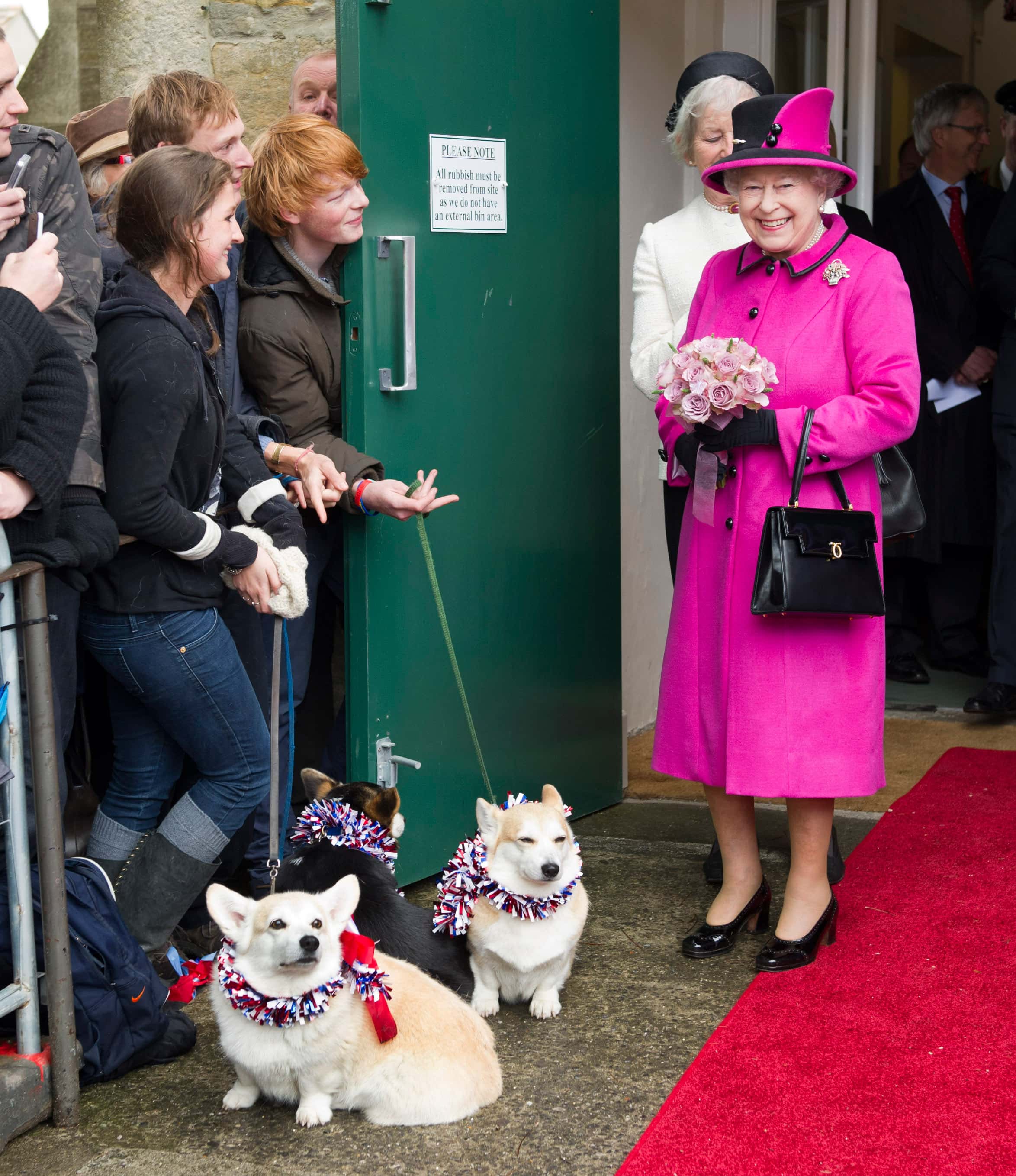 Queen Elizabeth II greest well wishers with corgis during a visit to Sherborne Abbey on May 1, 2012 in Sherborne, England.  The Queen and Duke of Edinburgh are visiting the South West of England as part of their Diamond Jubilee Tour of the country.