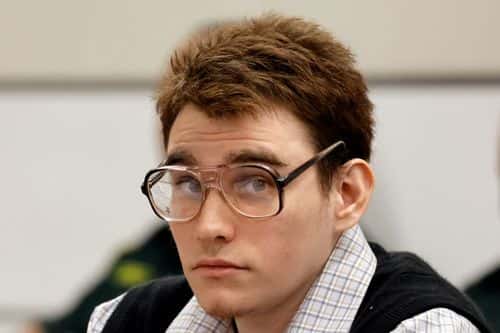 Marjory Stoneman Douglas High School shooter Nikolas Cruz looks up as Assistant Public Defender Melisa McNeill gives the defenses opening statement during the penalty phase of his trial at the Broward County Courthouse August 22, 2022 in Fort Lauderdale, Florida. Cruz previously plead guilty to all 17 counts of premeditated murder and 17 counts of attempted murder in the 2018 shootings.