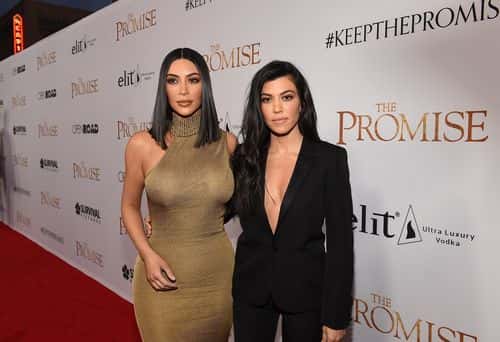 TV personalities Kim Kardashian West (L) and Kourtney Kardashian attend the premiere of Open Road Films' 