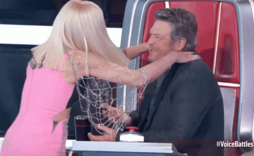 Gwen jumped from her seat to scold her husband for his 'steal' (Screenshot from The Voice/YouTube)