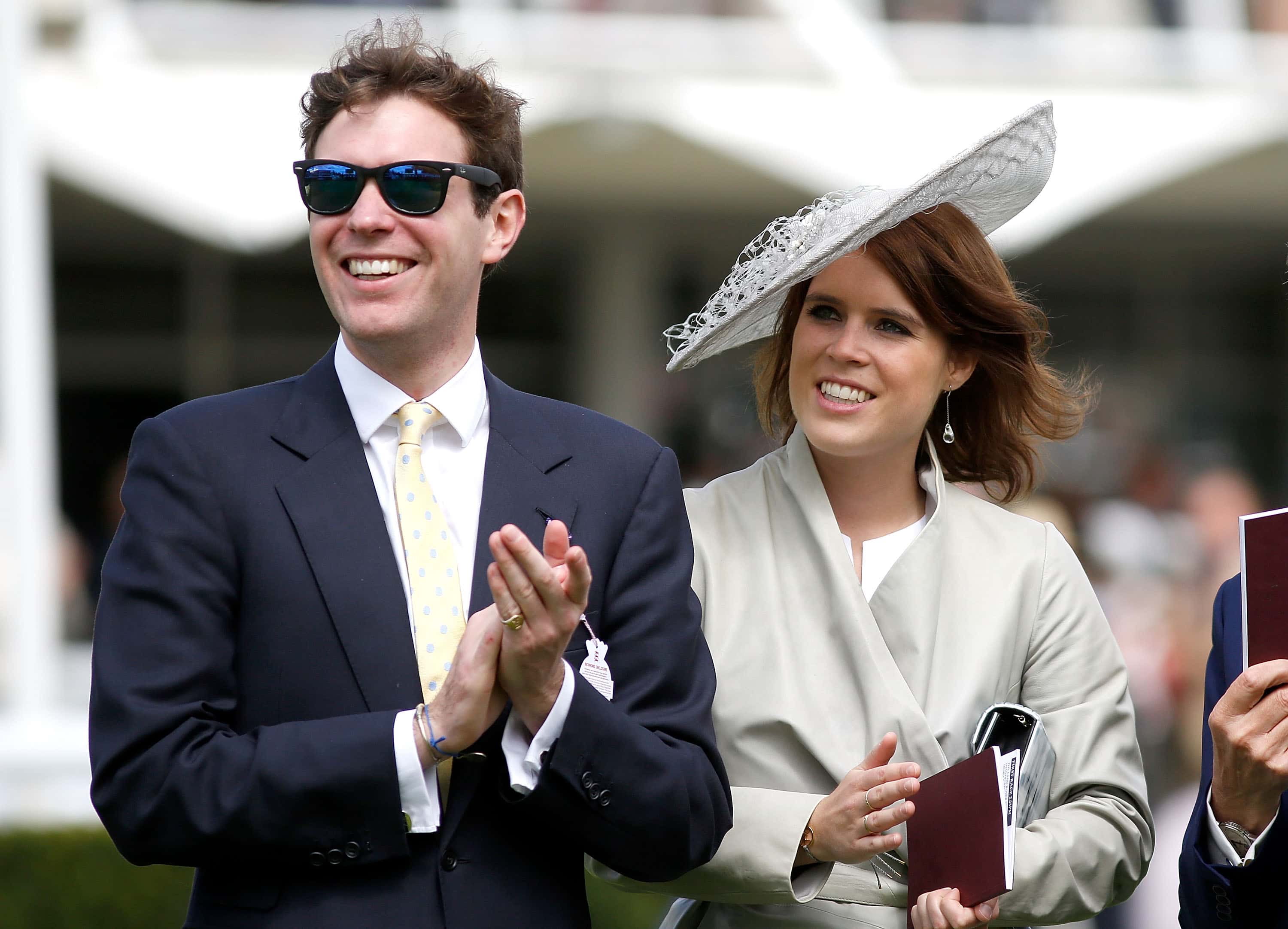 Princess Eugenie and Jack Brooksbank (L) attend day three of the Qatar Goodwood Festival at Goodwood Racecourse on July 30, 2015 in Chichester, England.