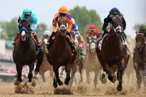 The field heads to the first turn during the 149th running of the Kentucky Derby at Churchill Downs on May 06, 2023 in Louisville, Kentucky.