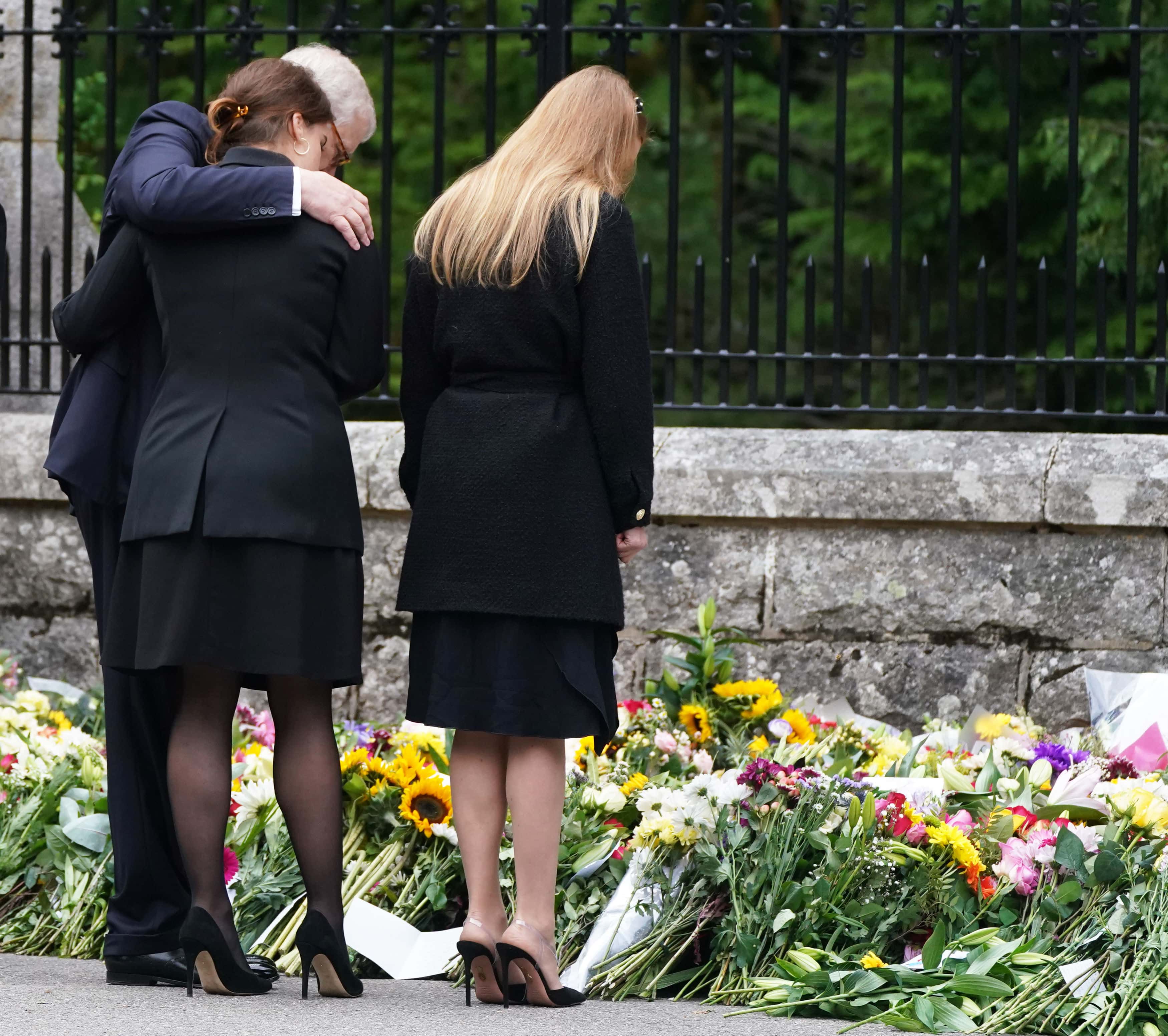 Princess Beatrice of York, Princess Eugenie of York and Prince Andrew, Duke of York look at messages and floral tributes left by members of the public after attending a service at Crathie Kirk church near Balmoral following the death of Queen Elizabeth II on September 10, 2022 in Crathie near Aberdeen, United Kingdom. Elizabeth Alexandra Mary Windsor was born in Bruton Street, Mayfair, London on 21 April 1926. She married Prince Philip in 1947 and acceded to the throne of the United Kingdom and Commonwealth on 6 February 1952 after the death of her Father, King George VI. Queen Elizabeth II died at Balmoral Castle in Scotland on September 8, 2022, and is succeeded by her eldest son, King Charles III.