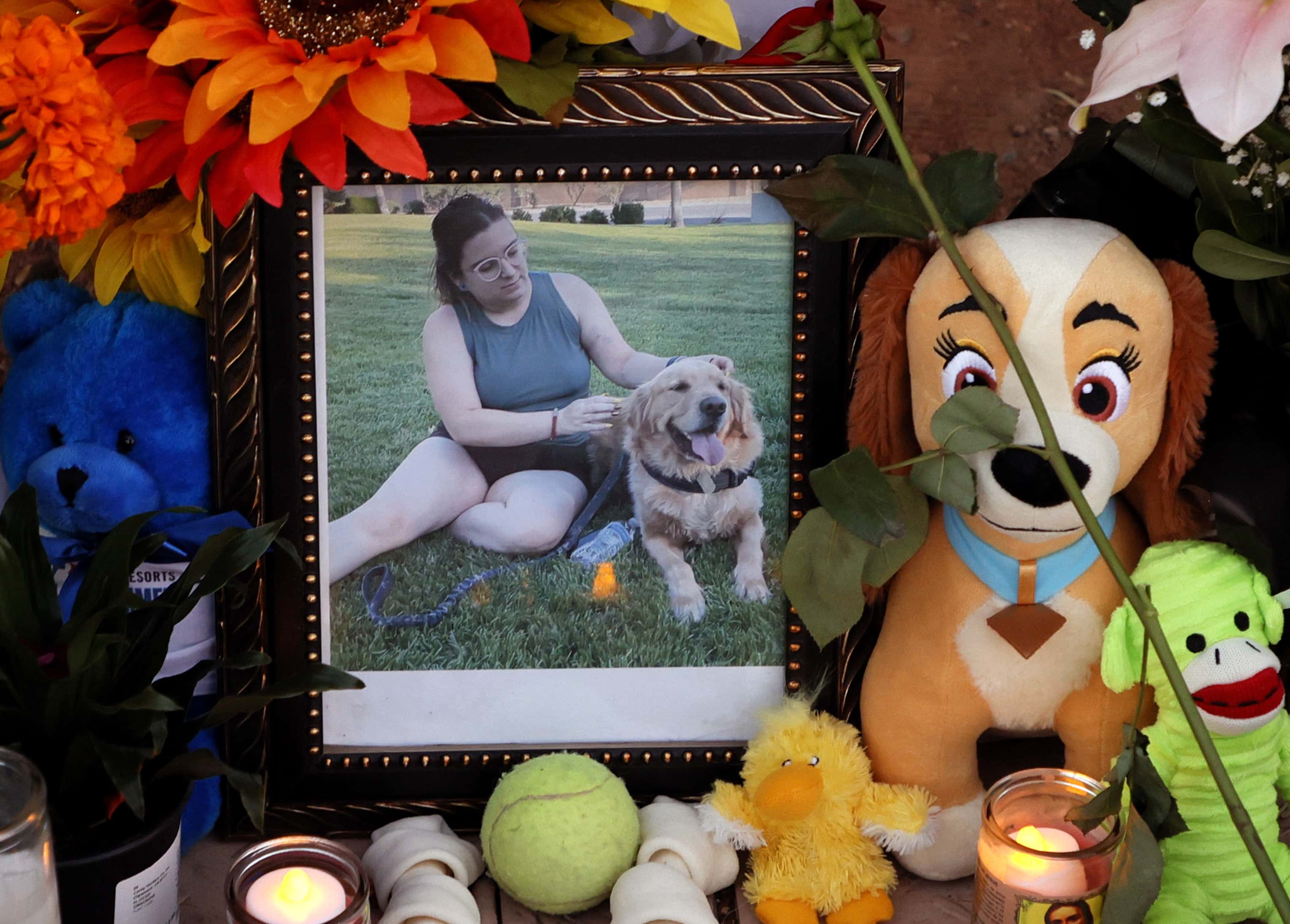 A photograph of Tina Tintor and her dog Max is displayed among items left at a roadside memorial near the site where they died in a vehicle crash involving former Las Vegas Raiders player Henry Ruggs III on November 4, 2021 in Las Vegas, Nevada. Police and prosecutors say Ruggs was driving his Chevrolet Corvette at up to 156 mph with a blood-alcohol level twice the legal limit in Nevada when he hit the back of Tintor's Toyota RAV4 on Tuesday morning, causing her vehicle to catch fire. Ruggs and his girlfriend, Kiara Je'nai Kilgo-Washington, were hospitalized for injuries suffered in the wreck. The Raiders later released Ruggs after he was booked into the Clark County Detention Center on multiple felony DUI and reckless driving charges.