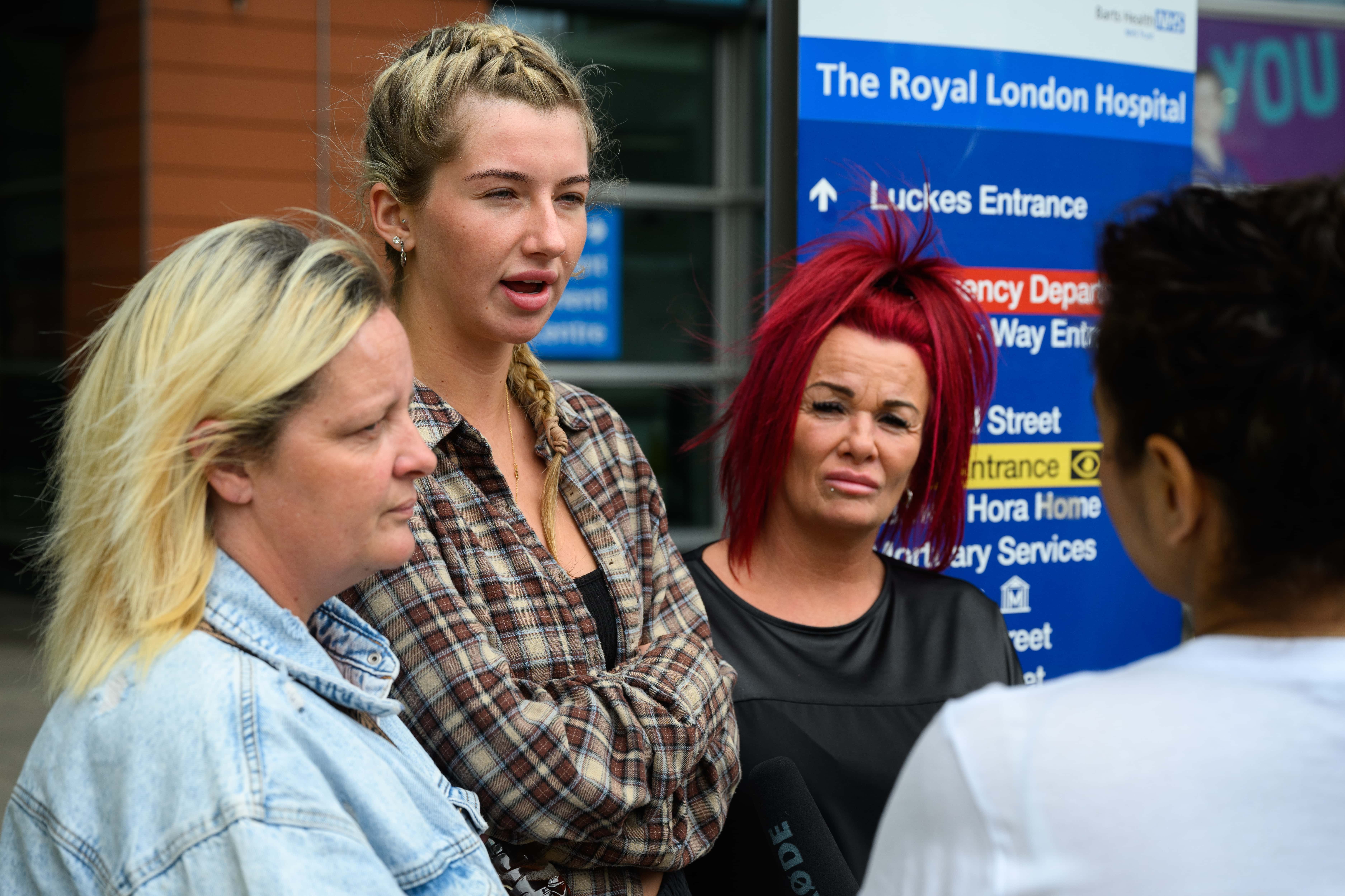 Ella Carter (2nd L), the sister-in-law of Archie Batterbee, is interviewed by media outside the Royal London Hospital on August 02, 2022 in London, England. Hollie Dance and Paul Battersbee, the parents of Archie Battersbee, 12, have been fighting against the Doctors treating their son who have concluded that he is brain-stem dead and that continued life-support treatment is not in his best interests. (Photo by Leon Neal/Getty Images)