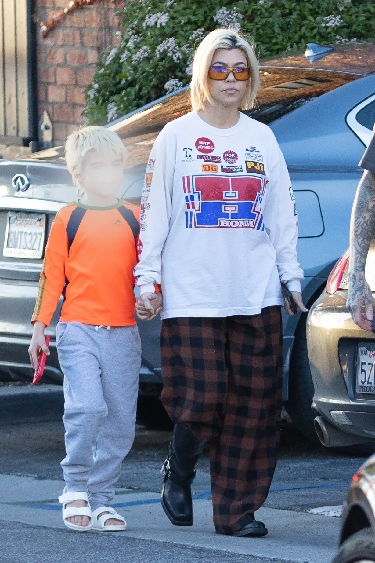 Kourtney Kardashian appeared laidback as she headed for dinner with her husband Travis Barker and son Reign (Backgrid)