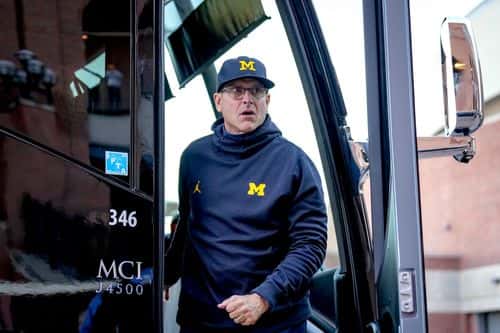 Head coach Jim Harbaugh of the Michigan Wolverines arrives before the game against the Michigan State Spartans at Michigan Stadium on October 29, 2022 in Ann Arbor, Michigan.
