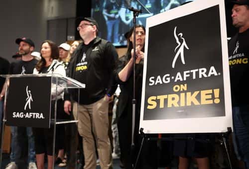 SAG-AFTRA President Fran Drescher (2nd L) stands at a press conference announcing their strike against Hollywood studios on July 13, 2023 in Los Angeles, California. Members of SAG-AFTRA, Hollywood’s largest union which represents actors and other media professionals, will join striking WGA (Writers Guild of America) workers at midnight in the first joint walkout against the studios since 1960. The strike could shut down Hollywood productions completely with writers in the third month of their strike against the Hollywood studios.