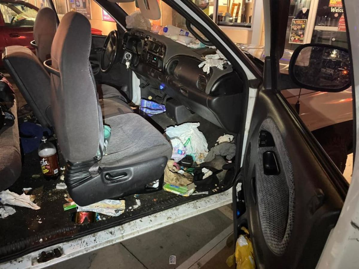 Photos show the trash-filled Dodge pickup truck the mother and children traveled in before she was arrested by police
(Facebook/Anderson Police Dept)