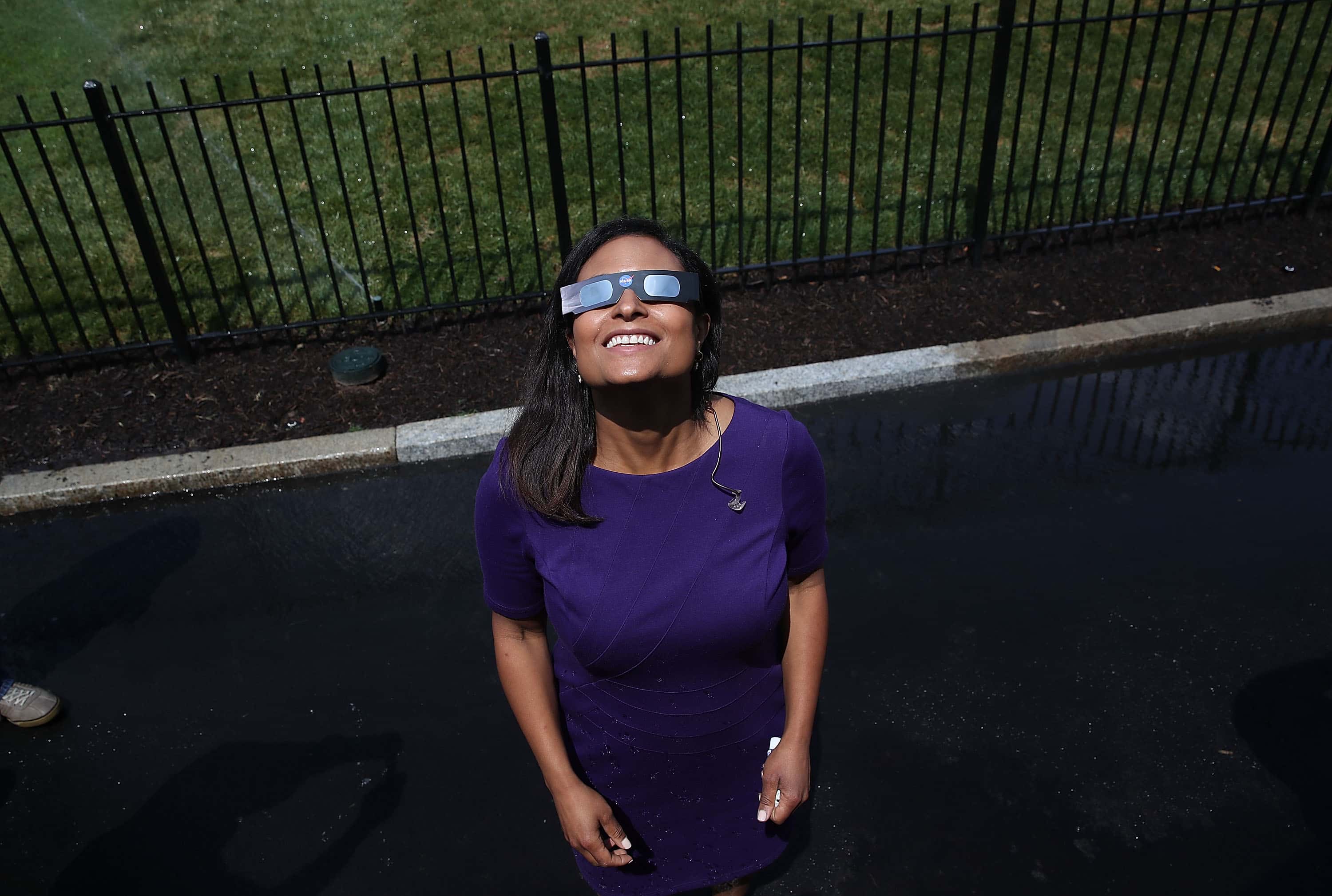 WASHINGTON, DC - AUGUST 21: NBC News reporter Kristen Welker wears special glasses to view the solar