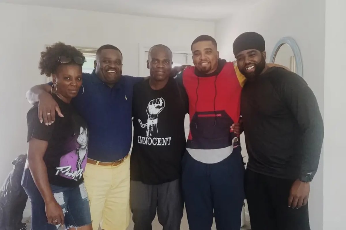 Cure, seen with his family members, was driving to visit his mother in Florida when he was killed Monday (Facebook/Innocence Project of Florida)