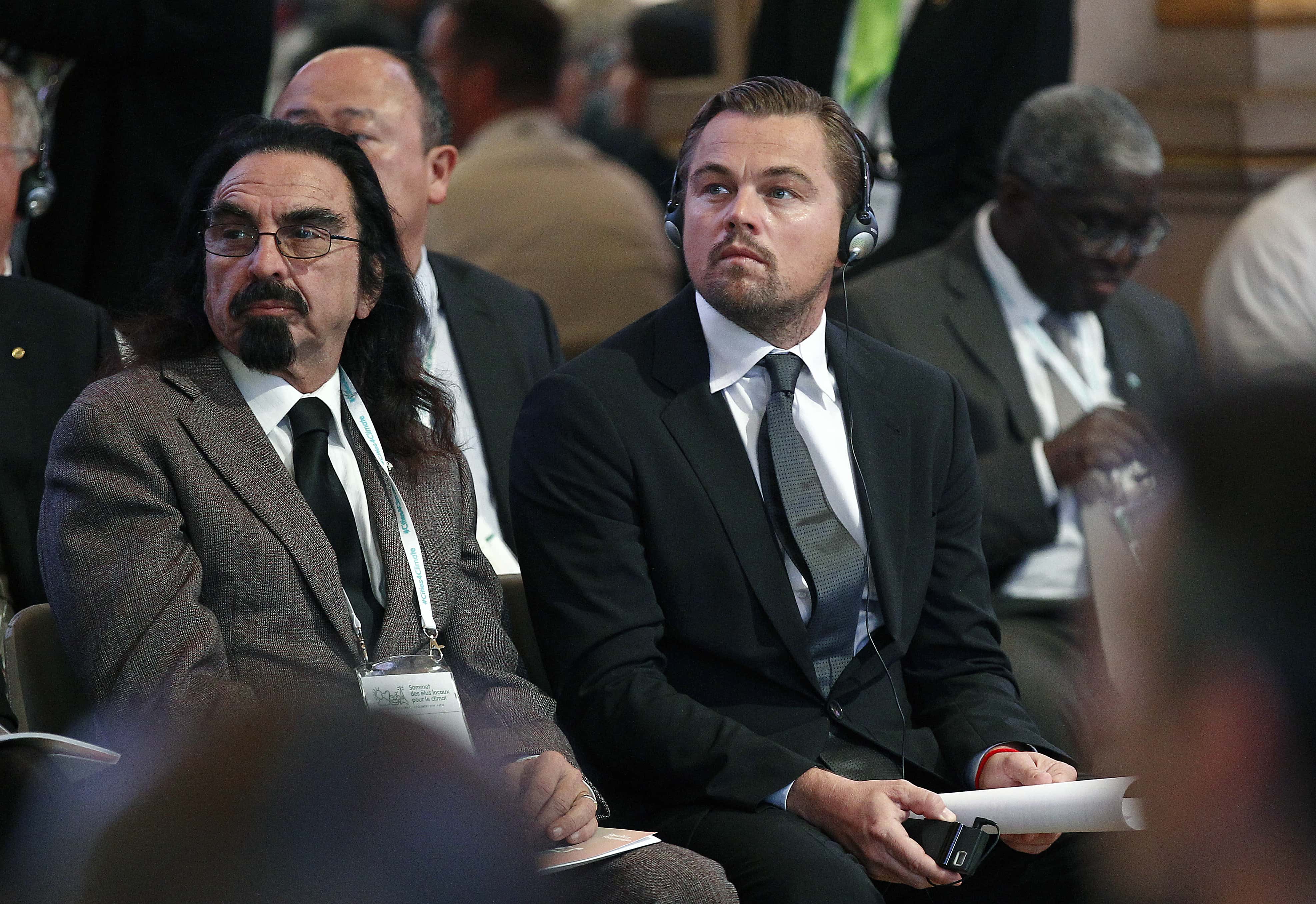 US actor Leonardo DiCaprio (R) and his father George DiCaprio (L) attend a Summit of Local elected for Climate at the Paris city hall on December 04, 2015 in Paris, France. Thousand mayors from different cities gather at the Paris city hall during the COP21, Paris Climate Conference.