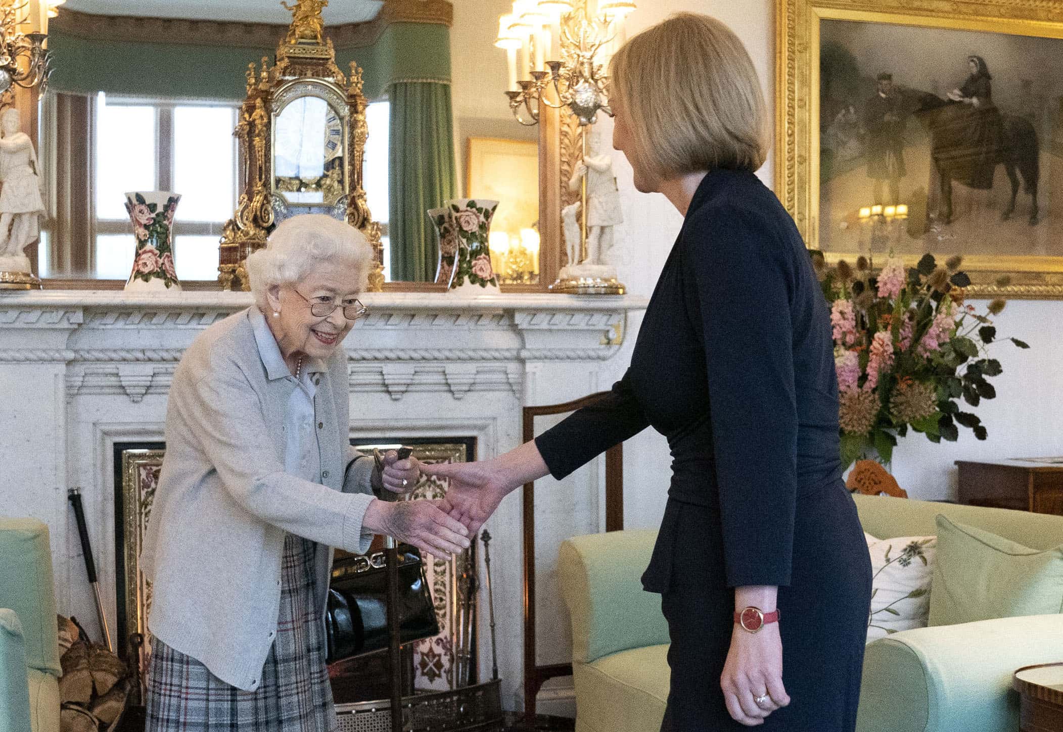 Queen Elizabeth greets newly elected leader of the Conservative party Liz Truss as she arrives at Balmoral Castle for an audience where she will be invited to become Prime Minister and form a new government on September 6, 2022 in Aberdeen, Scotland. The Queen broke with the tradition of meeting the new prime minister and Buckingham Palace, after needing to remain at Balmoral Castle due to mobility issues.