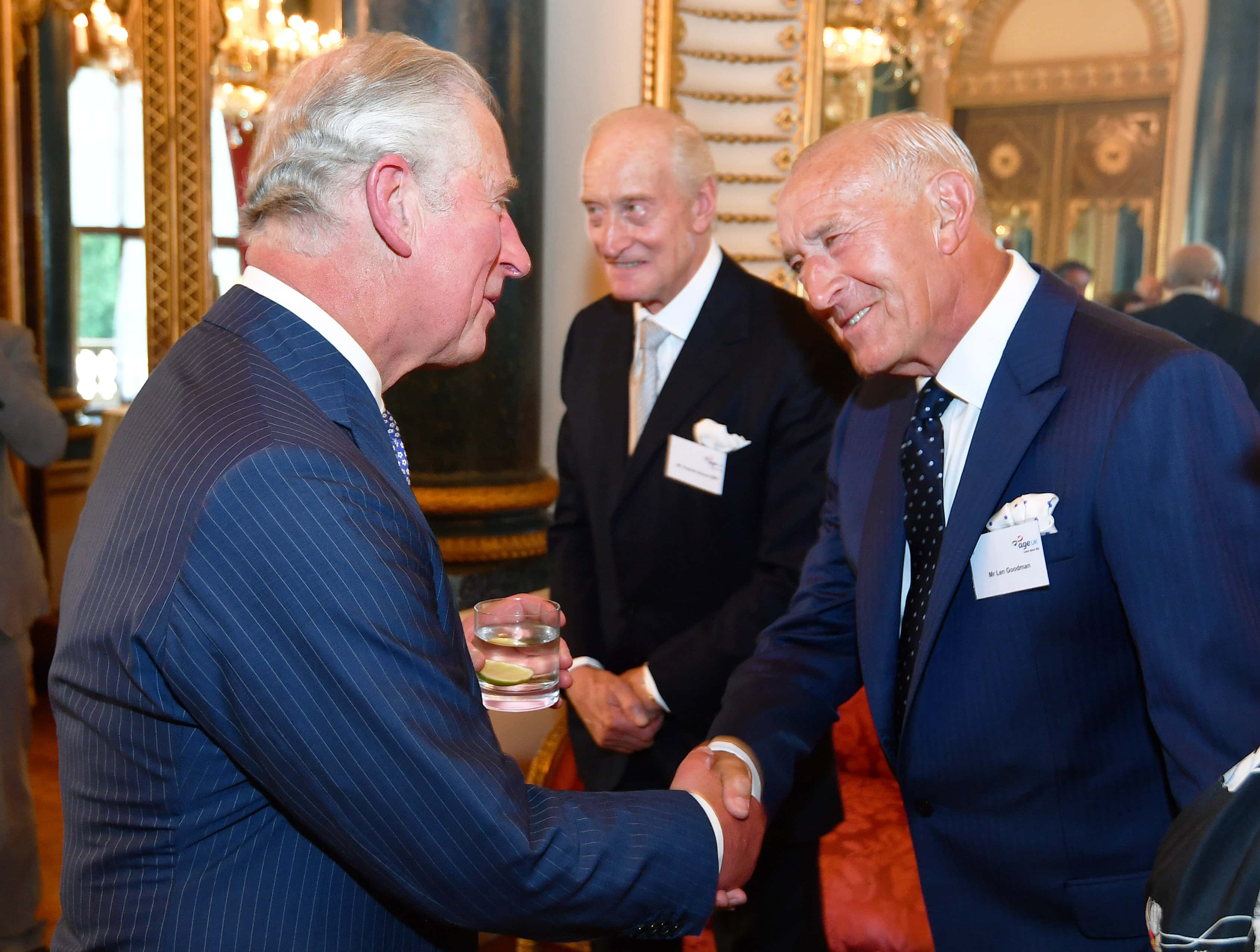 Prince Charles, Prince of Wales speaks to Charles Dance and Len Goodman and during a reception for Age UK at Buckingham Palace on June 6, 2018 in London, England. (Photo by John Stillwell -WPA Pool/Getty Images)