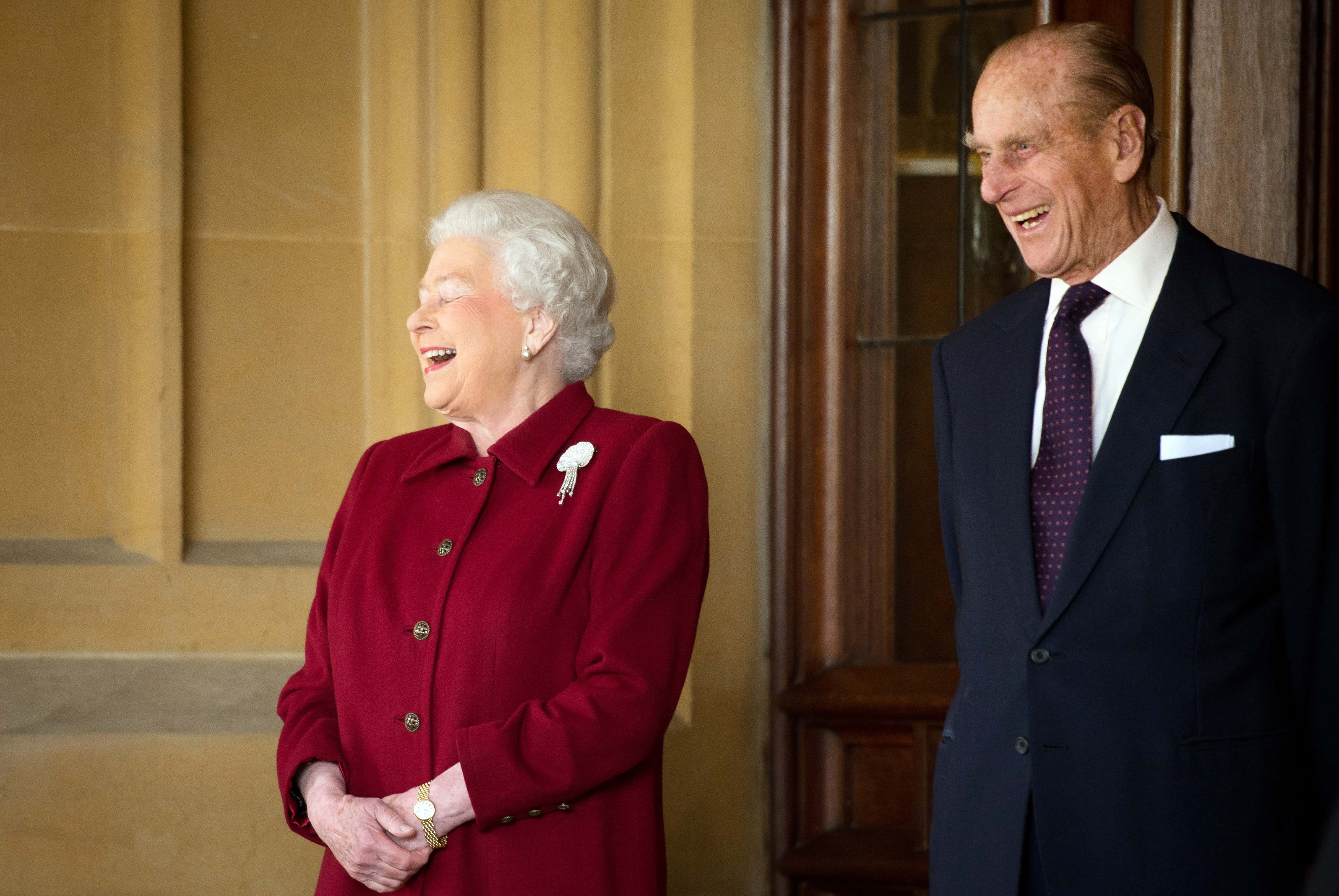 Britain's Queen Elizabeth II and Prince Philip, Duke of Edinburgh react as they bid farewell to Irish President Michael D. Higgins and his wife Sabina (not pictured) at the end of their official visit at Windsor Castle on April 11, 2014 in Windsor, United Kingdom. Ireland's Michael D. Higgins is making the first state visit by a president of the republic since it gained independence from neighbouring Britain. The visit comes three years after Queen Elizabeth II made a groundbreaking trip to the republic, which helped to heal deep-rooted unease and put British-Irish relations on a new footing.