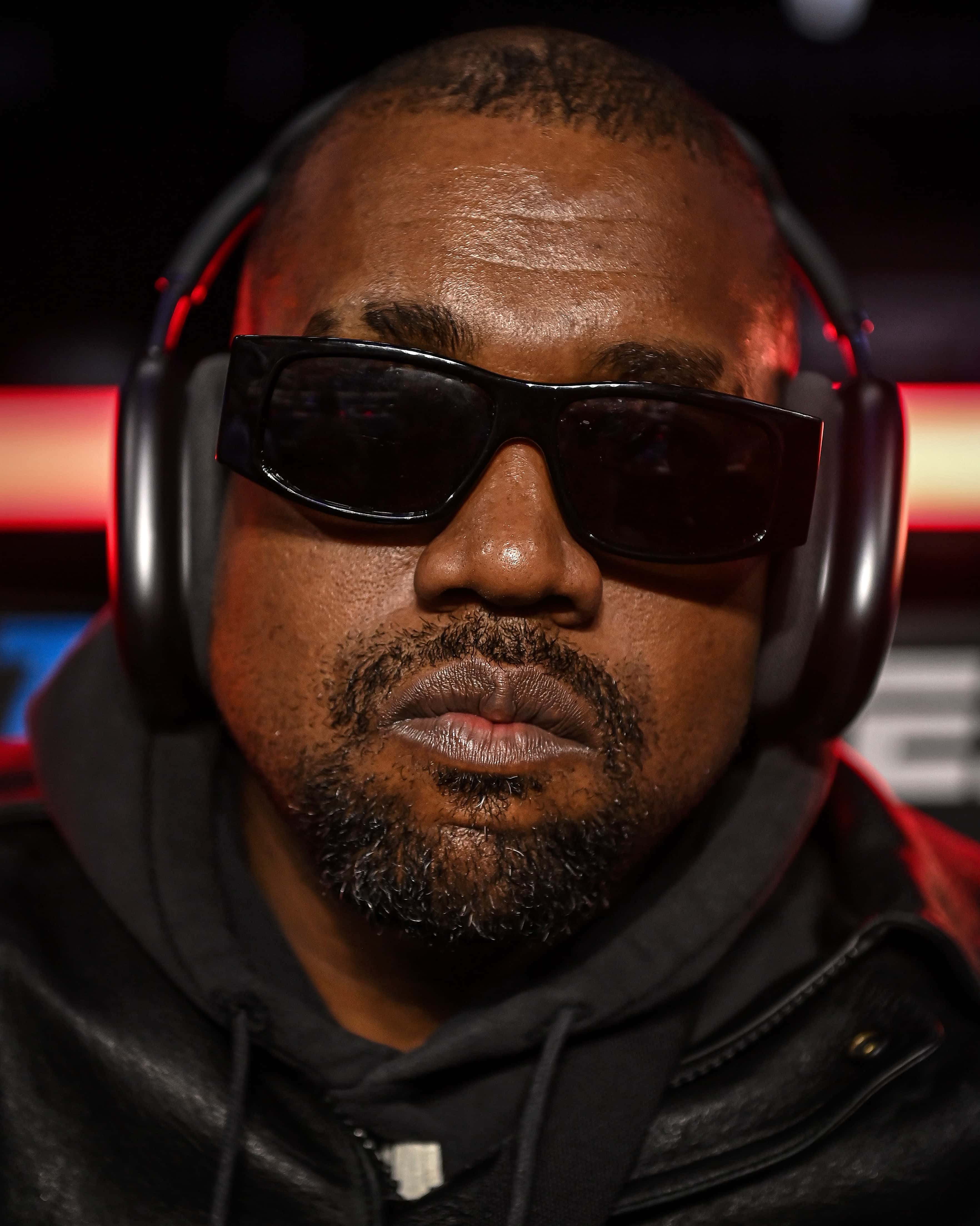 Ye poses for a photo as he arrives for the fight between Jamel Herring and Shakur Stevenson at State Farm Arena on October 23, 2021 in Atlanta, Georgia.