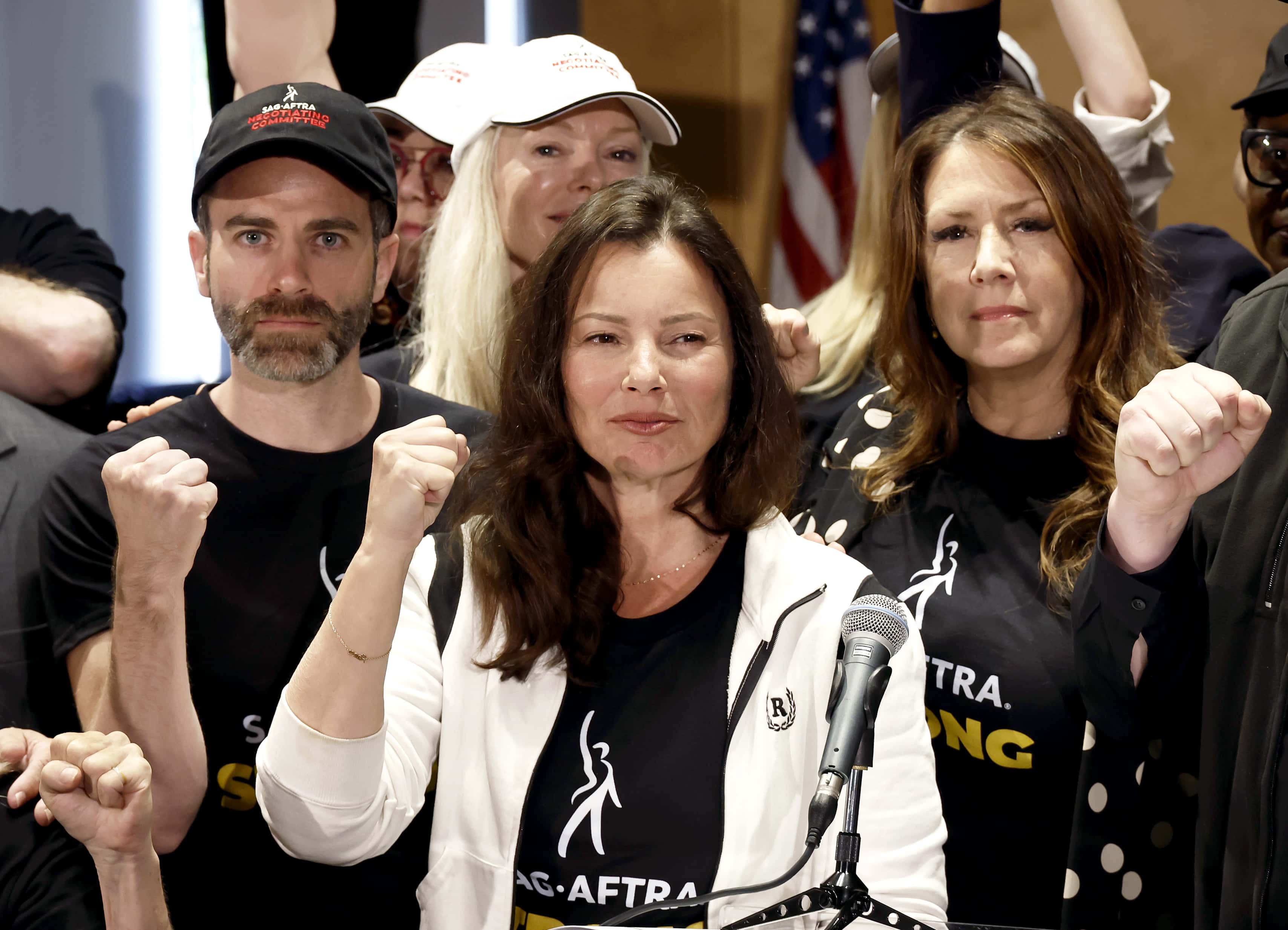LOS ANGELES, CALIFORNIA - JULY 13: (L-R) Ben Whitehair, Frances Fisher, SAG President Fran Drescher, Joely Fisher, National Executive Director, and SAG-AFTRA members are seen as SAG-AFTRA National Board holds a press conference for vote on recommendation to call a strike regarding the TV/Theatrical contract at SAG-AFTRA on July 13, 2023 in Los Angeles, California. (Photo by Frazer Harrison/Getty Images)